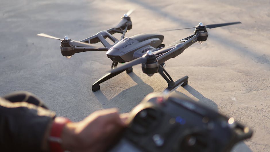 Image depicting a person operating a drone in a business setting