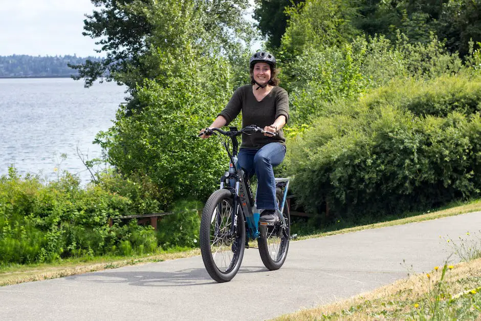 An image showing a person wearing a helmet while riding an e-bike in the wilderness.