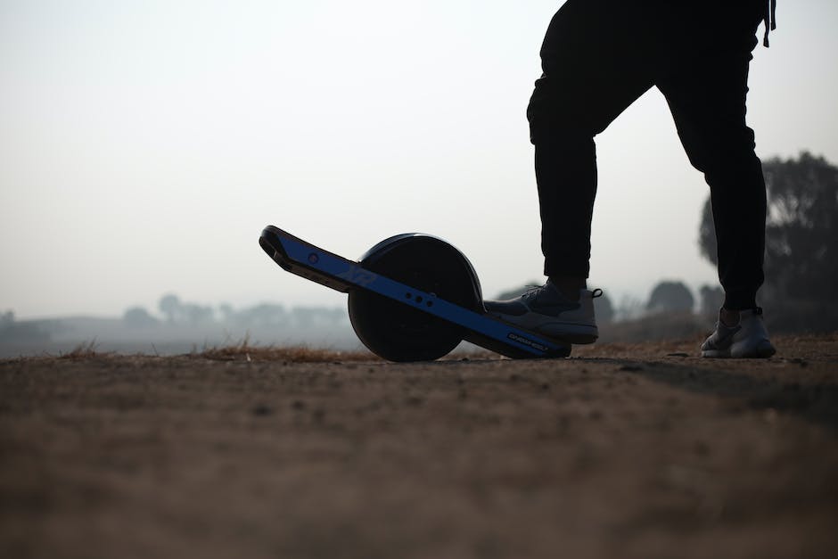 An image of an electric skateboard in action, with the rider gliding effortlessly over a smooth surface