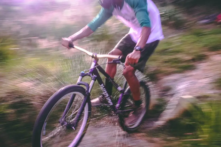 A mountain e-bike with a person riding it on a trail.