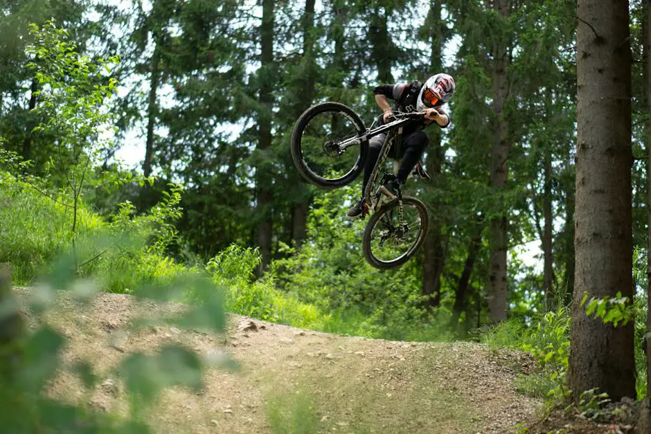 A person riding a mountain e-bike through a picturesque trail in the forest